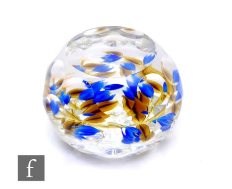 A 20th Century Perthshire magnum glass paperweight, of dome form with facet cut sides and top, internally decorated with styl