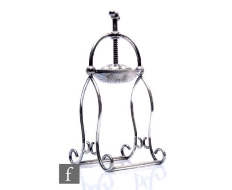 An Edwardian plated lemon squeezer, mechanical operation, on scroll stand and bar support, height 26cm. 