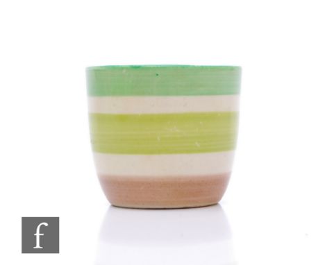 A Clarice Cliff Bizarre pattern egg cup, green and brown banded design, height 4cm. 