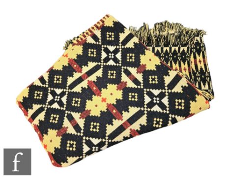 A vintage woollen Welsh tapestry black, yellow and deep orange fringed edge blanket or carthen, measures 200cm x 170cm.