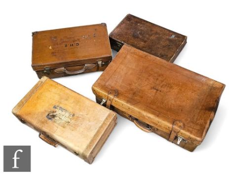 Three vintage brown stitched leather suitcases and a hide example. (4) 