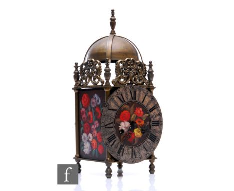 A 17th Century style brass lantern clock, silvered chapter ring with painted floral centre, the movement striking on a bell, 