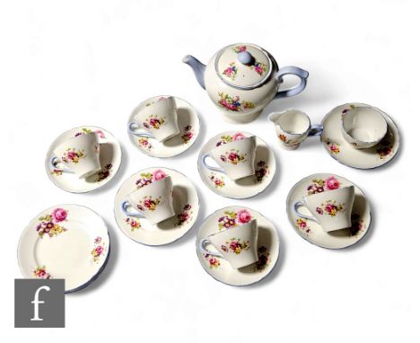 A Shelley New Cambridge shape teaset decorated with a floral spray including roses and blue banding, comprising a teapot, six