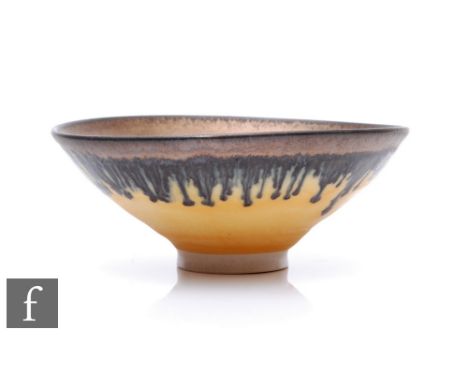 A small later 20th Century Studio Pottery porcelain bowl in the manner of Dame Lucie Rie, the small circular foot rising to a