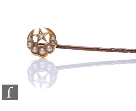 A gold and seed pearl set crescent moon stick pin, with solitaire diamond set star. 