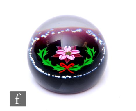 A later 20th Century William Manson for Caithness glass paperweight, of domed form, in the Noel pattern, internally decorated