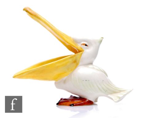 A 1930s Wade Pottery model of a pelican with large open mouth, picked out in enamel colours, printed mark, height 16cm. 