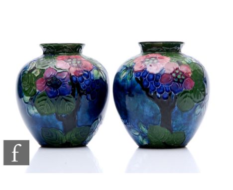 A pair of 1920s pottery vases designed by Roger Dean for Thomas Forester &amp; Sons, each of ovoid form with a flared collar 