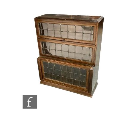 A 1930s oak glazed leaded light three sectional bookcase height 108cm x depth 37cm x width 90cm 