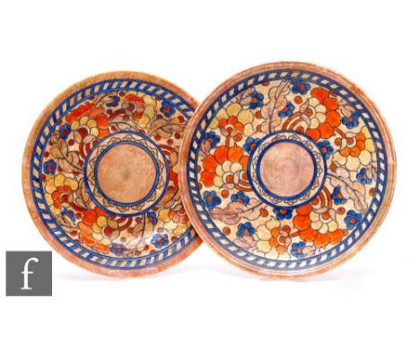 A 1930s Crown Ducal charger by Charlotte Rhead, tube line decorated in the Byzantine pattern with a band of stylised flowers 