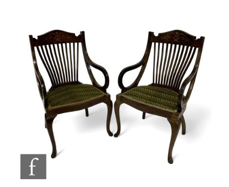 A pair of Edwardian marquetry inlaid slat back drawing room chairs, the pierced splats below an acanthus decorated panel abov