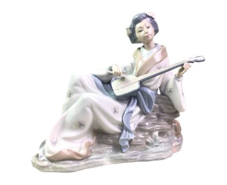 GROUP OF PORCELAIN FIGURES, including three Lladro figures, numbers 7636, 7622 and a further Lladro figure, along with a grou
