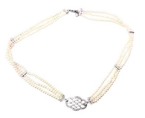 PEARL CHOKER, formed by three strands, with central diamond section set with diamond chips, the pearls interspaced by similar