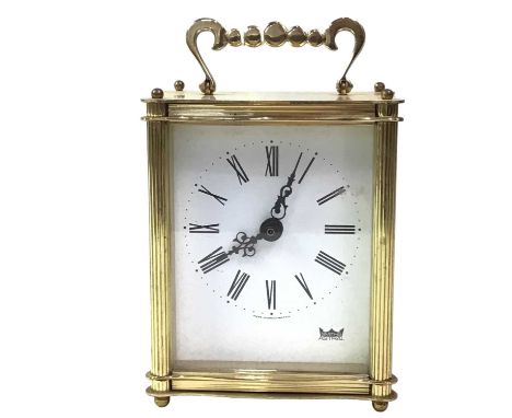 BRASS CARRIAGE CLOCK, MAKER SMITHS the circular dial with Roman numerals, the case raised on ball feet14.5cm high