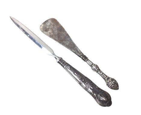 WHITE METAL PILL BOX, AND OTHER ITEMS decorated with flowers and foliage, along with a silver handled shoe horn, a silver han