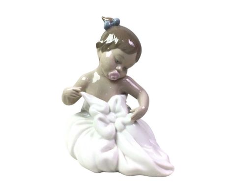 LARGE GROUP OF NAO FIGURES, AND OTHER FIGURES one modelled as a girl sat holding a cat, another as a girl holding a rabbit, o