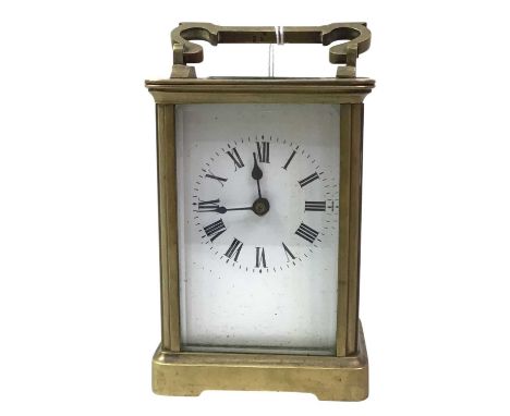 THREE BRASS CARRIAGE CLOCKS, each with carry handle, all circular dials with Roman numerals and outer seconds track, one cloc