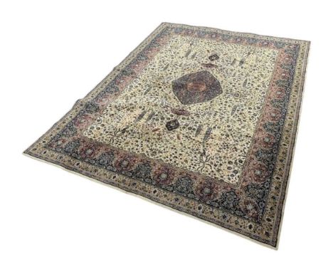LARGE PERSIAN STYLE CARPET, machine knotted, the large central medallion on a floral ground 