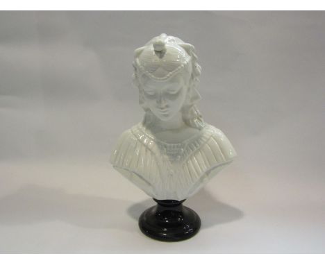 A decorative ceramic bust with black base, 29cm tall