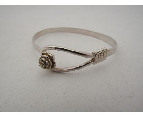 A bangle with floral clasp, marked 925