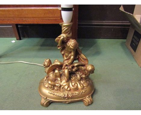 A gilt plaster cherub lamp base, 33cm high