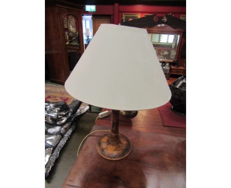 A poker work table lamp base with cream shade