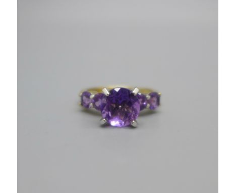 A silver gilt, five stone amethyst ring, N 