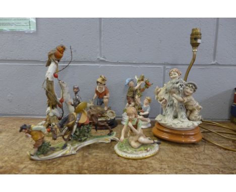 Four Capodimonte figures, a figure of a robin and stoat and a figural lamp stand 