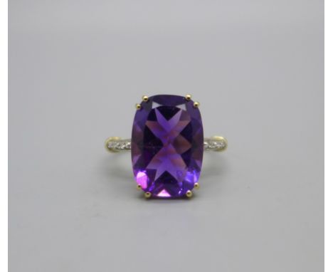 A 9ct gold, purple stone and diamond ring, 2.9g, O 