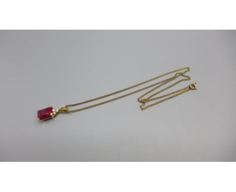 A silver gilt and synthetic ruby pendant on chain 