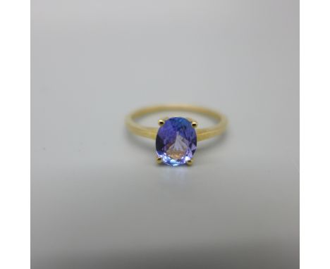 A 9ct gold ring set with a purple stone, 1.9g, O 