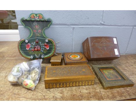 A carved wooden box decorated with butterflies, three other wooden boxes, an Austrian musical instrument, a Polish portrait p
