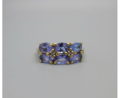 A 9ct gold, six stone tanzanite ring, 2.5g, U 