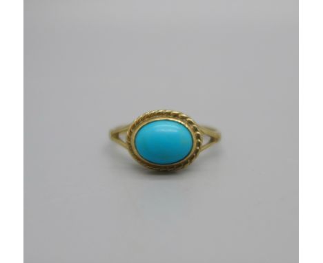 A 9ct gold and turquoise coloured ring, 1.6g, M 