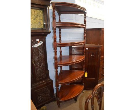 A large Victorian style mahogany corner what not or shelf with six shelves with turned side supports, 193cm high