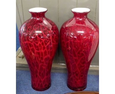 A large pair of Art Glass vases of baluster shape, the ruby ground with a coloured red design, 42cm high