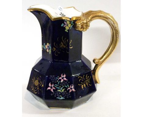 A 19th Century Spode jug with biting snake handle, the blue ground with painted floral decoration, red factory mark and patte