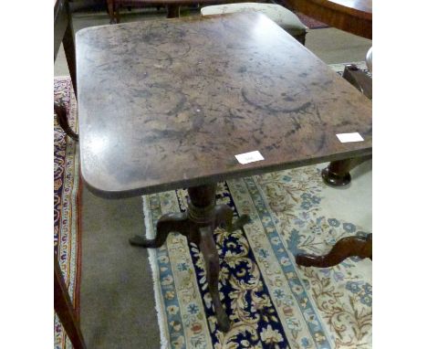 A Georgian mahogany tripod based flip top table with rectangular top and a turned column, height 69cm