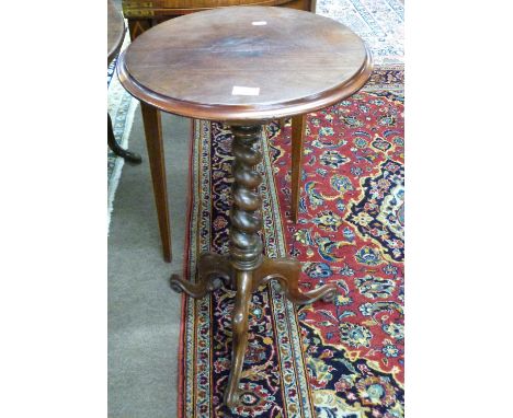 Victorian mahogany wine table with circular top over a barley twist column and tripod base, 72cm high