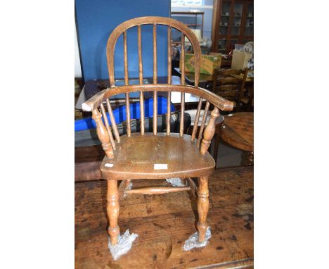 A elm seated Windsor type stick back chair , 70cm high