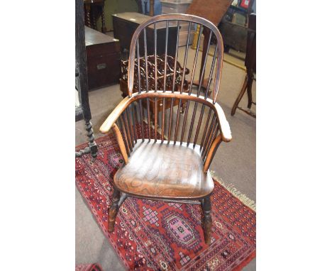 A 19th Century elm seated stick back Windsor type chair on turned legs