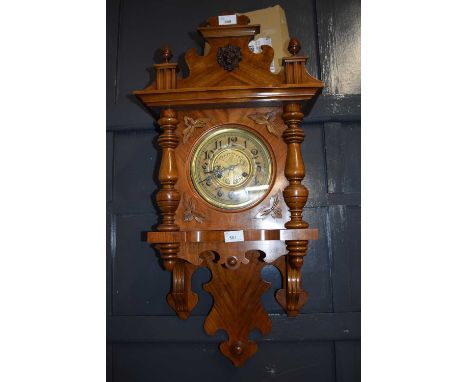 Late 19th or early 20th Century continental walnut cased wall clock set in an architectural case with applied carved lions he