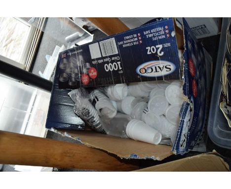 Box containing a large quantity of polystyrene cups and lids