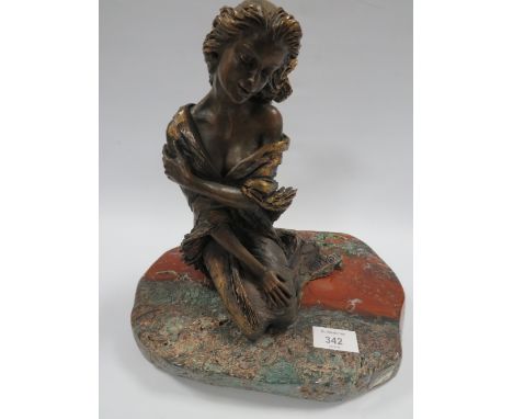 AN EBANO BRONZED SCULPTURE FROM THE VIDAL COLLECTION DEPICTING A KNEELING SEMI NUDE GIRL, raised on a marble plinth, No. 2552