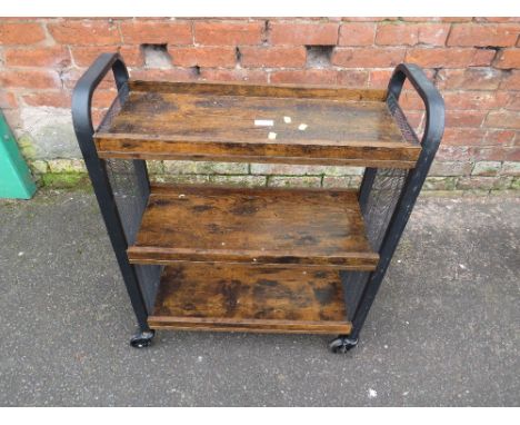 A THREE TIER BOOK TROUGH ON CASTORS
