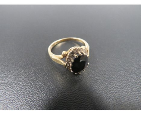 AN 18 CARAT GOLD SAPPHIRE AND DIAMOND RING 