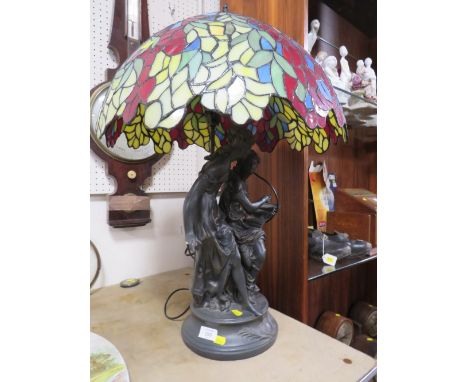 A LARGE FIGURATIVE TABLE LAMP WITH TIFFANY STYLE SHADE A/F 