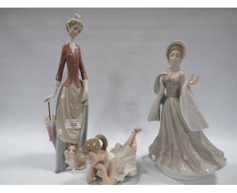 A LARGE LADRO LADY FIGURE WITH A DOG TOGETHER WITH A NAO BALLERINA 