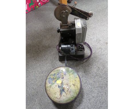 AN&nbsp;ANTIQUE PROJECTOR AND FILM REELS A/F