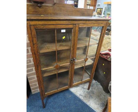 A VINTAGE OAK GLAZED TWO DOOR CABINET W-84 CM